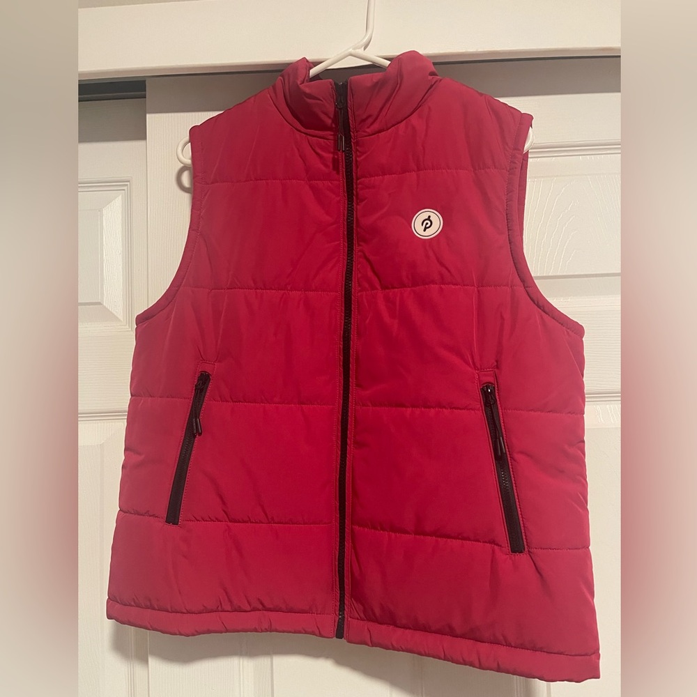 Women’s Peloton Red Puffer Vest. Size small. New with tags.
